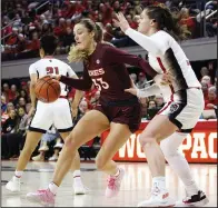  ?? (AP/Ben McKeown) ?? Virginia Tech’s Elizabeth Kitley (33) works against North Carolina State’s River Baldwin during the Hokies’ 72-61 upset victory Thursday night in Raleigh, N.C.