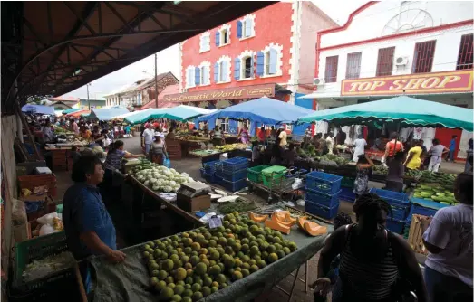  ??  ?? The market in the capital, Cayenne, supplied by the vegetable holdings run by the ethnic Hmong from Laos