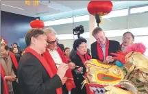  ?? PROVIDED TO CHINA DAILY ?? Passengers enjoy learning about Chinese culture aboard a cruise ship to celebrate Spring Festival.