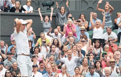  ?? GLYN KIRK/AFP/GETTY IMAGES ?? Kevin Anderson celebrates after defeating John Isner 26-24 in a gruelling final set of their semifinal match Friday.