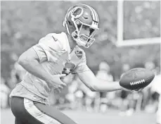  ?? GEOFF BURKE, USA TODAY SPORTS ?? “I got my hands full this season with 16 games,” Redskins QB Kirk Cousins said, dismissing any lingering contract concerns.