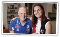  ??  ?? Nathan Burke with his daughter Alice, who will wear his famous St Kilda No.3 jumper on debut.