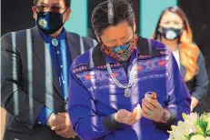  ??  ?? All Pueblo Council of Governors Chairman Willfred Herrera Jr. of Laguna Pueblo prepares for an invocation and blessing ahead of a discussion with U.S. Interior Secretary Deb Haaland and tribal leaders.