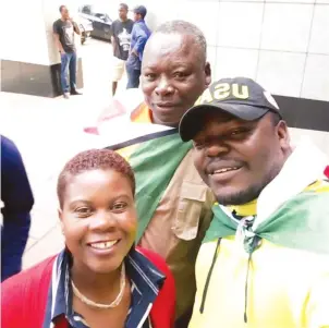  ??  ?? PROUDLY ZIMBABWEAN . . . Former Warriors captain Moses Chunga, draped in his national flag, was part of the huge crowd that marched on the streets of Harare in support of the Zimbabwe Defence Forces on Saturday