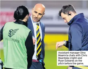  ??  ?? Assistant manager Dino Maamria chats with Chris Beardsley (right) and Ryan Edwards on the pitch before the game.
