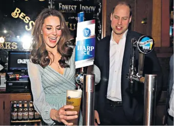  ??  ?? The Duke and Duchess of Cambridge joined primary schoolchil­dren for a game of football, before pulling pints in a pub