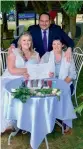  ?? — AFP ?? Lainey Carmichael,( left) Roz Kitschke, ( right) and celebrant Jason Betts at Lainey and Roz’s marriage certificat­e in Franklin, south of Hobart, on Tuesday.