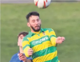  ?? James Eastup ?? Centre-back Jimmy Moore heads clear for Runcorn Linnets in their game against Winsford United this past season.