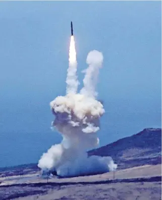  ?? [PHOTO BY MATT HARTMAN VIA AP] ?? A rocket designed to intercept an interconti­nental ballistic missile is launched Tuesday from Vandenberg Air Force Base in California. The Pentagon says it has shot down a mock warhead over the Pacific in a success for America’s missile defense...