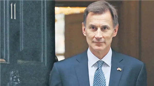  ?? ?? Jeremy Hunt, the Chancellor, yesterday announced a £55 billion package of tax rises and spending cuts as he tried to balance Britain’s books