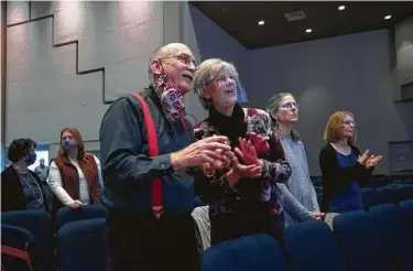  ?? Photos by May-Ying Lam / Washington Post ?? Steve and DebbieWard and Dawn Younce sing during Sunday service on Dec. 6 at Houston Northwest Church. Masks are encouraged, but not everyone wears them.