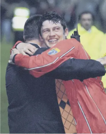  ??  ?? 0 Dundee United winger Andy Mclaren hugs manager Billy Kirkwood after the 1996 play-off win.