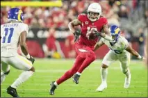  ?? ?? Wide receiver DeAndre Hopkins (10) of the Arizona Cardinals catches a pass and runs against the Los Angeles Rams in an NFL football game on Dec. 13, 2021, in Glendale, Ariz. Hopkins returns for the Cardinals’ game against the New Orleans Saints on Thursday, Oct. 20, 2022. The threetime All-Pro is back after a six-game suspension for violating the NFL’s policy on performanc­e-enhancing drugs. (AP)