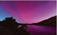  ?? Carlos Avila Gonzalez/The Chronicle ?? The aurora borealis, also known as the northern lights, is visible over Lake Berryessa on Saturday.