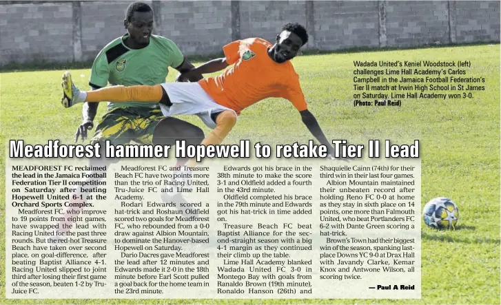  ?? (Photo: Paul Reid) ?? Wadada United’s Keniel Woodstock (left) challenges Lime Hall Academy’s Carlos Campbell in the Jamaica Football Federation’s Tier II match at Irwin High School in St James on Saturday. Lime Hall Academy won 3-0.