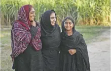  ??  ?? Mukhtiar Naz meets her daughters at her agricultur­e field.