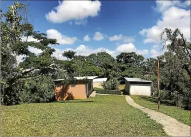  ?? GINGER RAE DUNBAR – DIGITAL FIRST MEDIA ?? Pictured is the camp site in Puerto Rico after the church members helped restore the roofs of the buildings and clear the debris from the yard.