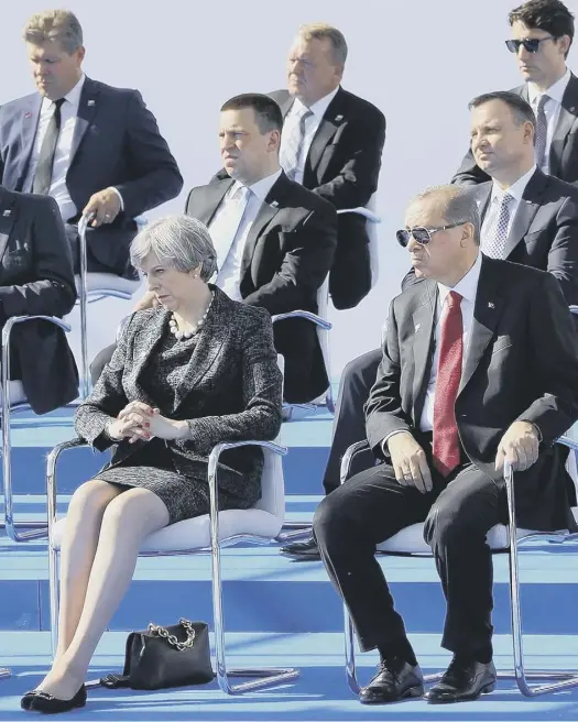  ??  ?? Trump and the Turkish president, Recep Tayyip Erdogan, at the start of the Nato summit in Brussels