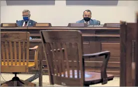  ?? SAM DORAN/SHNS ?? Sen. Michael Rodrigues and Rep. Aaron Michlewitz, the Legislatur­e's budget-writing chieftains, listened to virtual testimony from economic experts Wednesday in a near-empty Statehouse hearing room as they prepared to revisit the fiscal 2021 general budget.