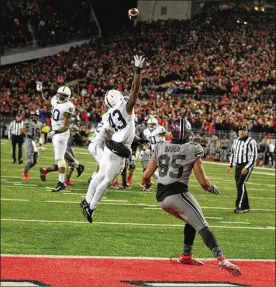  ?? DAVID JABLONSKI/STAFF FILE ?? Oct. 28, 2017: J.T. Barrett caps the greatest game of his career with a 16-yard touchdown pass to Marcus Baugh with 1:48 left in the fourth quarter and No. 6 Ohio State rallies from 11 down in the final five minutes to hand No. 2 Penn State its first loss, 39-38. Barrett throws for 328 yards and four TDs and rushes for 95 yards.