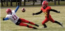  ??  ?? Swift Current Colts receiver Rhett Vavra looks to draw a penalty as Central’s Kienan Kleisinger covers the play.