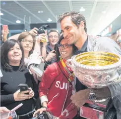  ??  ?? Federer is greeted by fans upon his arrival in Zurich.