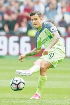  ?? — AFP photo ?? Liverpool’s Brazilian midfielder Philippe Coutinho plays the ball during the English Premier League football match between West Ham United and Liverpool at The London Stadium, in east London on May 14, 2017.