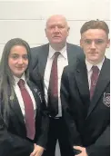  ??  ?? Lessons Olivia McLaren and Nathan McGarvey with head teacher Peter Bollen