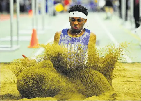  ?? Christian Abraham / Hearst Connecticu­t Media ?? Bunnell’s Stephen Blake competes in the long jump during the SWC Indoor Track and Field Championsh­ips in New Haven on Saturday.