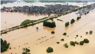  ?? Photo: AP ?? Floodwater­s inundate the town of Shangrao, Jiangxi province.