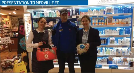  ??  ?? Deirdre and Ann Butler Of Higgins Pharmacy’s, Market Cross and Teeling Street, presenting a Medicare Medical Bag filled With accessorie­s and a match ball to Darren Kelly(coach) Merville Utd Football Club.