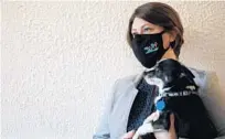  ?? RICARDO RAMIREZ BUXEDA/ORLANDO SENTINEL ?? Kissimmee Program Manager Tommi Pritchett gives a tour of The Center in downtown Kissimmee with dog Gus on Thursday.