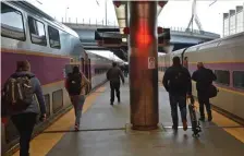  ?? CHRis cHRisTO / HeRald sTaFF File ?? HACKED: Passengers board commuter trains at North Station in 2019. Keolis Commuter Services, which runs the rail line, was hit by ransonware earlier this month.