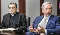  ?? LANNIS WATERS / THE PALM BEACH POST ?? The Rev. John Gallagher (left), with his attorney, Ted Babbitt, says the Diocese of Palm Beach defamed him by calling him a liar who needed “profession­al assistance.”