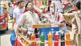  ?? PTI ?? A health care worker collects swab sample of a vendor for Covid-19 testing in Jammu.