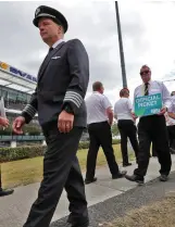  ??  ?? Ryanair pilots on the picket line outside Ryanair HQ in Airside, Swords, Dublin, yesterday afternoon on their third day of work stoppage. Photo: Colin Keegan, Collins