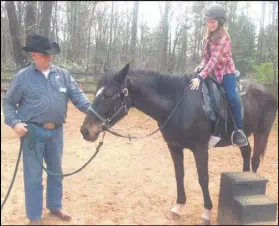 ??  ?? Madison Kaul, a sixth-grader at High Meadows School in Roswell, rides Bella Luna for the first time. Kaul helped take care of the thoroughbr­ed after she arrived at the school late last year near death.