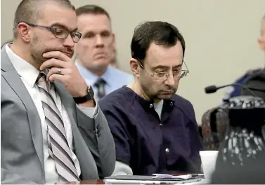  ?? PHOTO: AP ?? Larry Nassar sits with attorney Matt Newburg during his sentencing hearing yesterday in Lansing, Michigan. The former sports doctor had admitted molesting some of the United States’ top gymnasts for years.