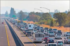  ?? DARRYL BUSH/THE PRESS DEMOCRAT VIA AP ?? Traffic is backed up heading South on Highway 101 during mandatory evacuation­s due to predicted danger from the Kincade Fire, in Windsor, Calif., on Saturday.