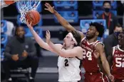  ?? A.J. MAST — THE ASSOCIATED PRESS ?? Gonzaga forward Drew Timme (2) shoots under Oklahoma guard Elijah Harkless (24) in the second half in the second round of the NCAA Tournament at Hinkle Fieldhouse in Indianapol­is on Monday.