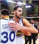  ?? Bay Area News Group/tns ?? Golden State Warriors’ Stephen Curry congratula­tes teammate Klay Thompson after defeating the Houston Rockets in Game 5 of their NBA second round playoff series at Oracle Arena in Oakland on May 8. The Golden State Warriors defeated the Houston Rockets 104-99.