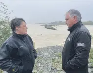  ?? MARLBOROUG­H DISTRICT COUNCIL ?? Emergency Management Minister Mark Mitchell talks to Marlboroug­h mayor Nadine Taylor next to the Wairau River yesterday.