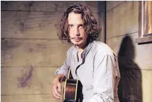  ?? CASEY CURRY/INVISION ?? Chris Cornell plays guitar during a portrait session in 2015 at The Paramount Ranch in Agoura Hills, Calif. Cornell, 52 died at a hotel in Detroit Thursday.