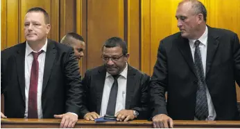  ?? ?? From left: Mark Lifman, Jerome Booysen and Andre Naude appear in the High Cape in Cape Town on 22 April. They face a host of charges, including murder, conspiracy to commit murder, money laundering and obstructio­n of justice. Photo: Jaco Marais/gallo Images
