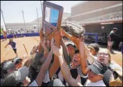  ?? Michael Quine Las Vegas Review-Journal @Vegas88s ?? Shadow Ridge celebrates its victory over Palo Verde on Saturday that clinched the Class 4A Sunset Region softball championsh­ip at Bishop Gorman High School.