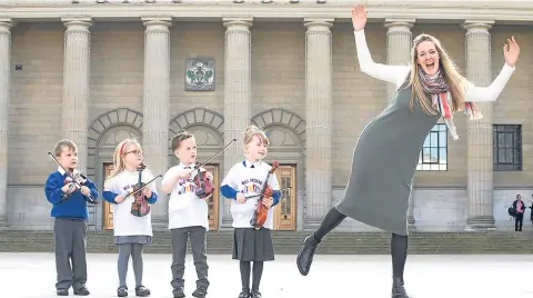  ?? Picture: Jeff Holmes. ?? Ryan Mackenzie, Bella Riddell, Rhylee Traynor and Caitlyn Bertie join Sistema Scotland chief executive Nicola Killean at the launch of the Sistema partnershi­p in Dundee.