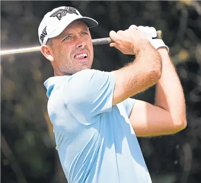  ?? Picture: Getty. ?? Charl Schwartzel of South Africa plays a shot from the fairway yesterday.