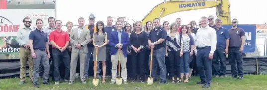  ?? —photo Vicky Charbonnea­u ?? On a windy Wednesday afternoon, May 17, several attended the traditiona­l groundbrea­king ceremony marking the beginning of the constructi­on of the Russell Sports Dome. Pictured are Mayor Pierre Leroux along with members of the municipal council, the...