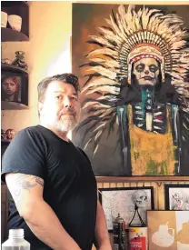  ?? COURTESY OF ALEX CHAVEZ ?? Artist Alex Chavez in the studio with his oil on canvas “Ash Moon Rising.”
