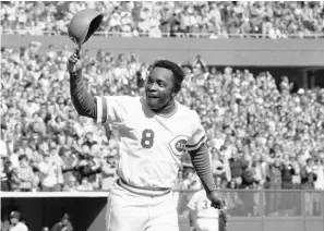  ?? Associated Press ?? This Oct. 16, 1976, file photo shows Cincinnati Reds second baseman Joe Morgan as he tips his helmet to the fans while rounding the bases after a homer in the first inning against the New York Yankees at Riverfront Stadium in Cincinnati.